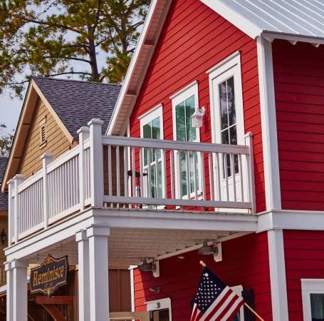 exterior of a red house with white pillars