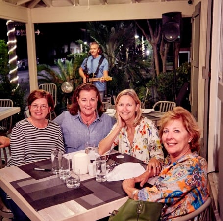 group of people sitting around a table