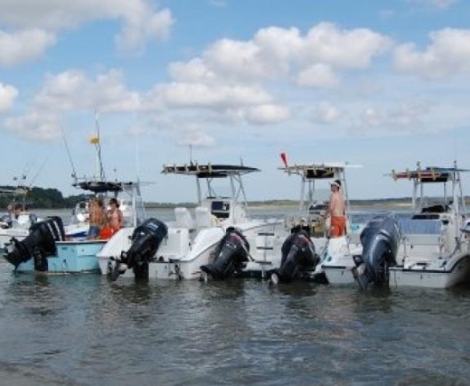 Boats lined up along the May River sand bar