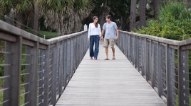 couple walking over a bridge